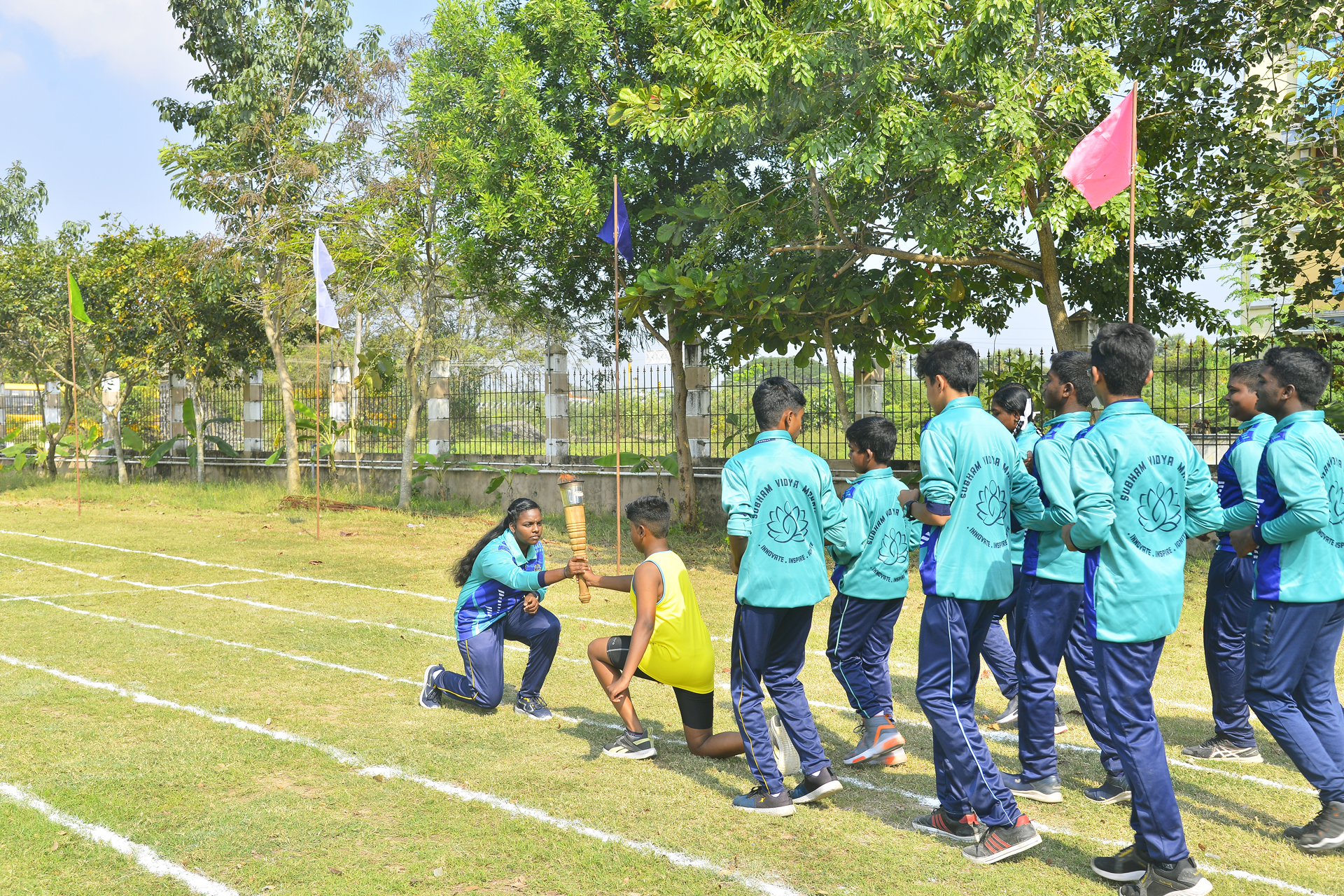 Three students are learning to work with 3D printing machine under the guidance of a senior teacher in a private school in Mayiladuthurai.